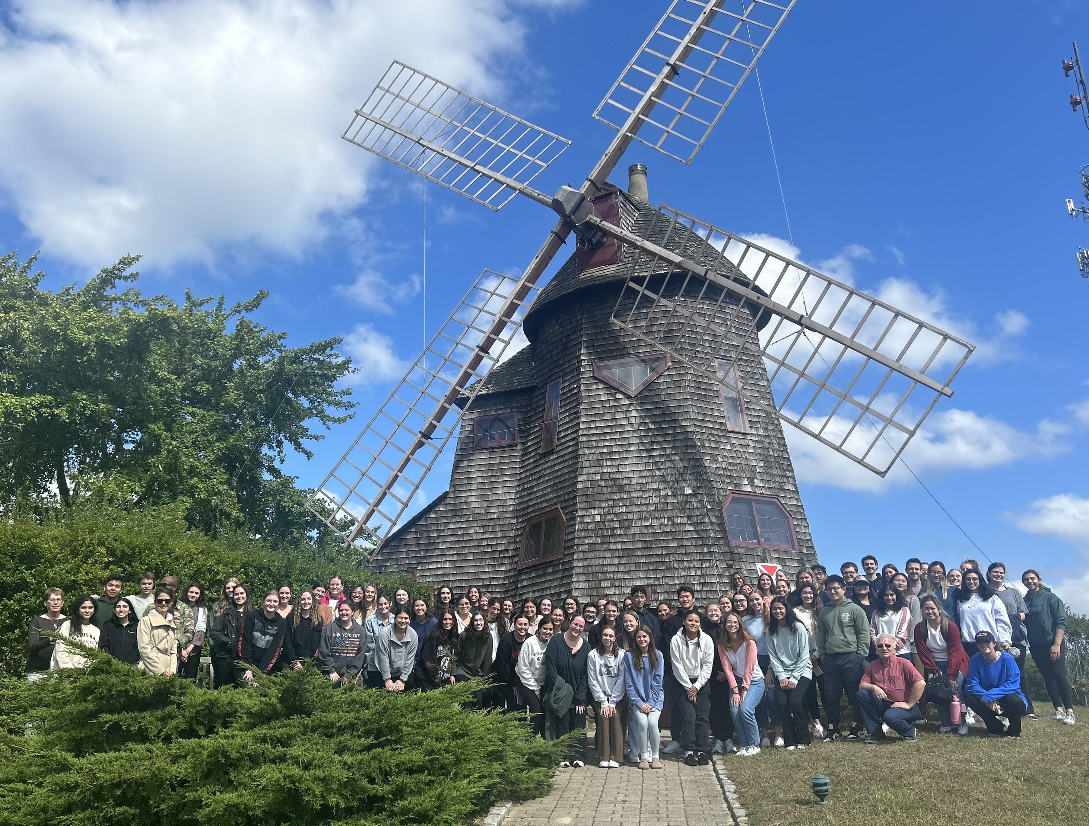 Southampton windmill behind campus students after Hope Walk 2023